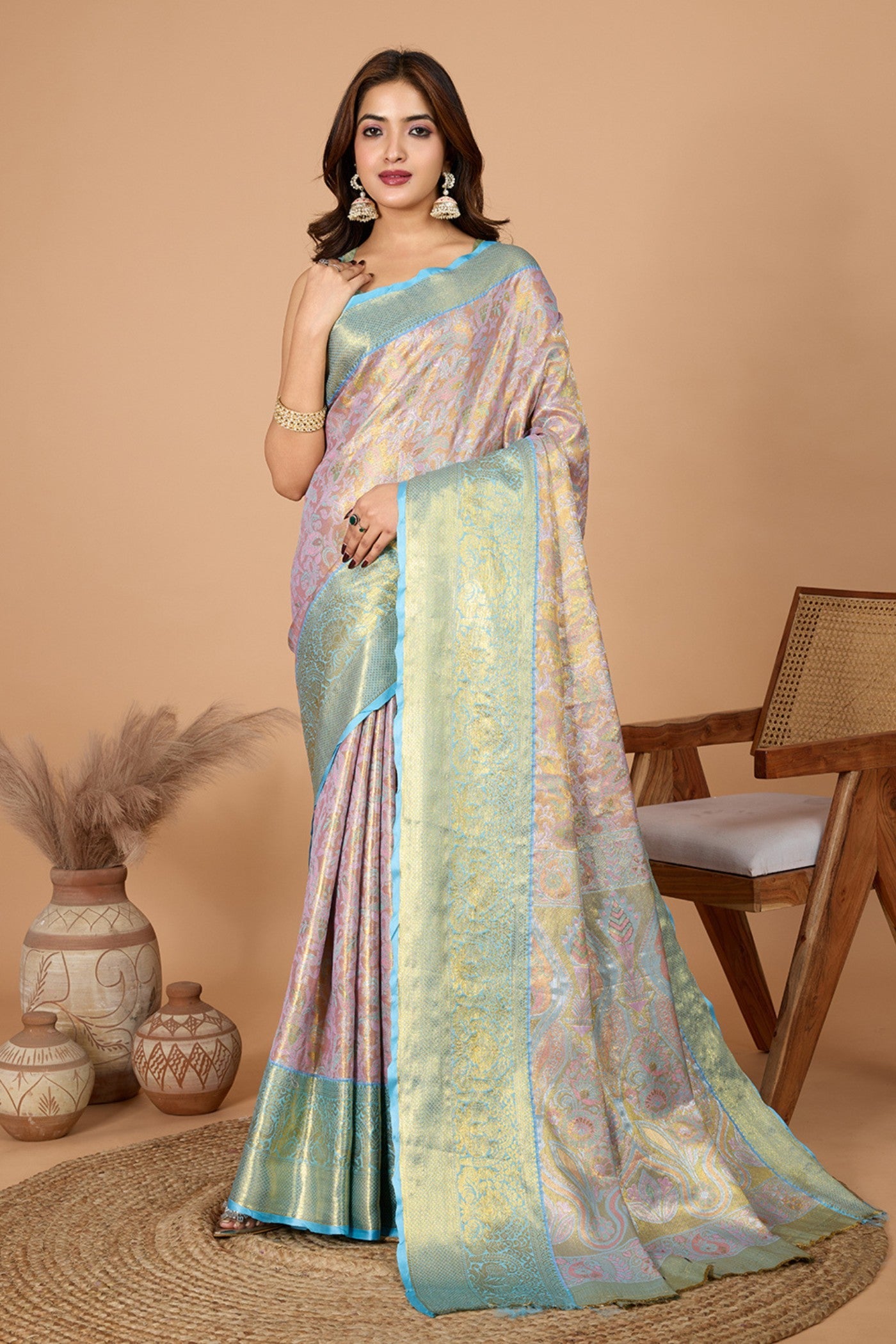 Brighten pink woven Kanjivaram silk saree with contrast zari border