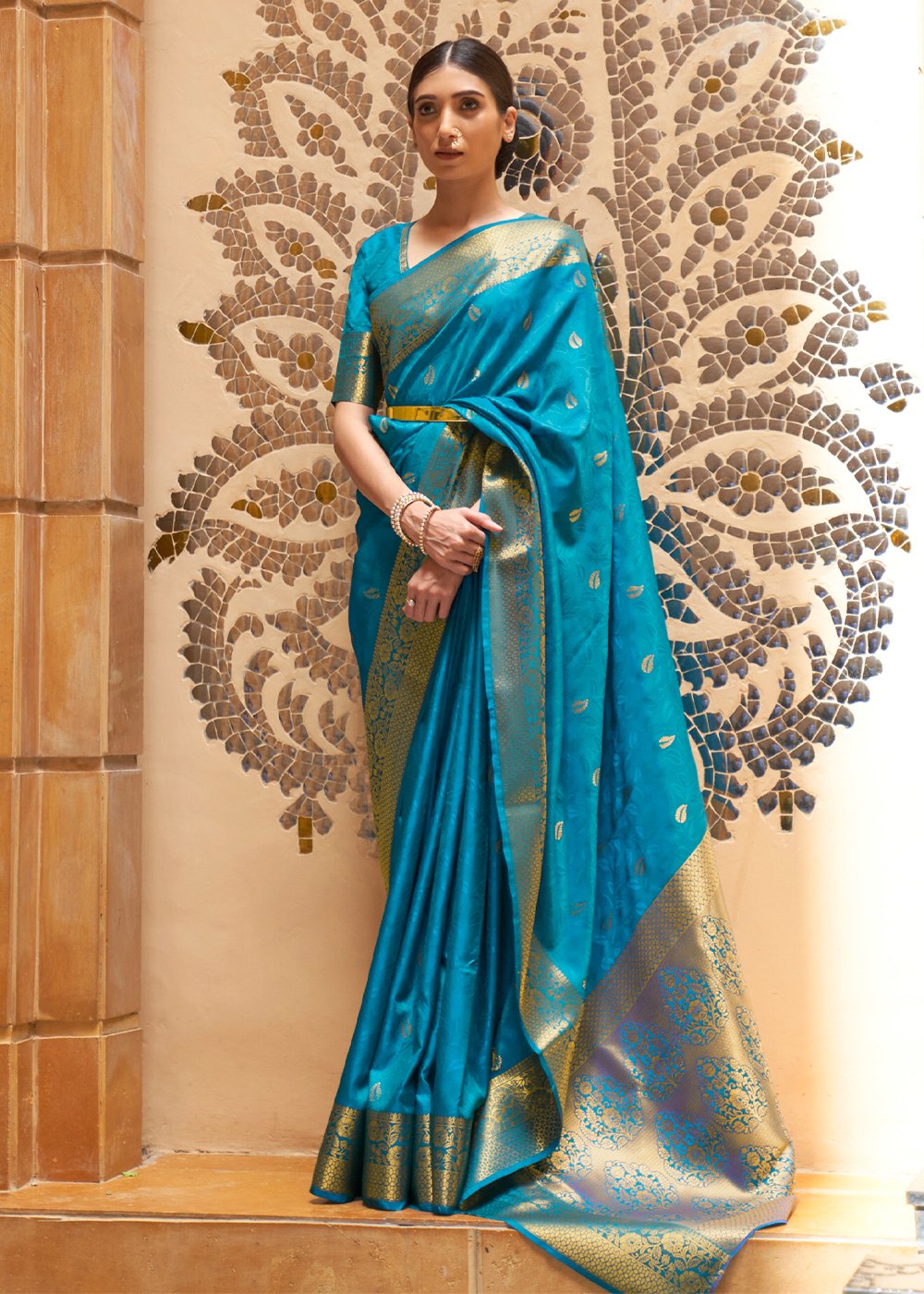 Model draping a Boston Blue zari woven Kanjivaram saree with a gold border and pallu, styled for a Nagpur wedding season