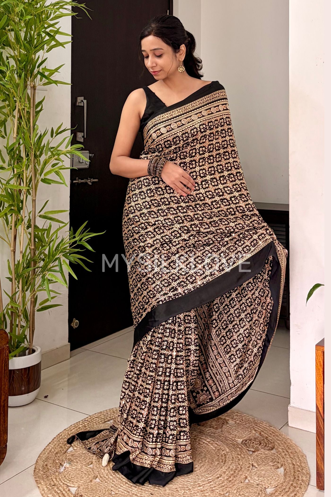 MySilkLove Metal Black Modal Ajrakh Satin Printed Mirror Work Saree