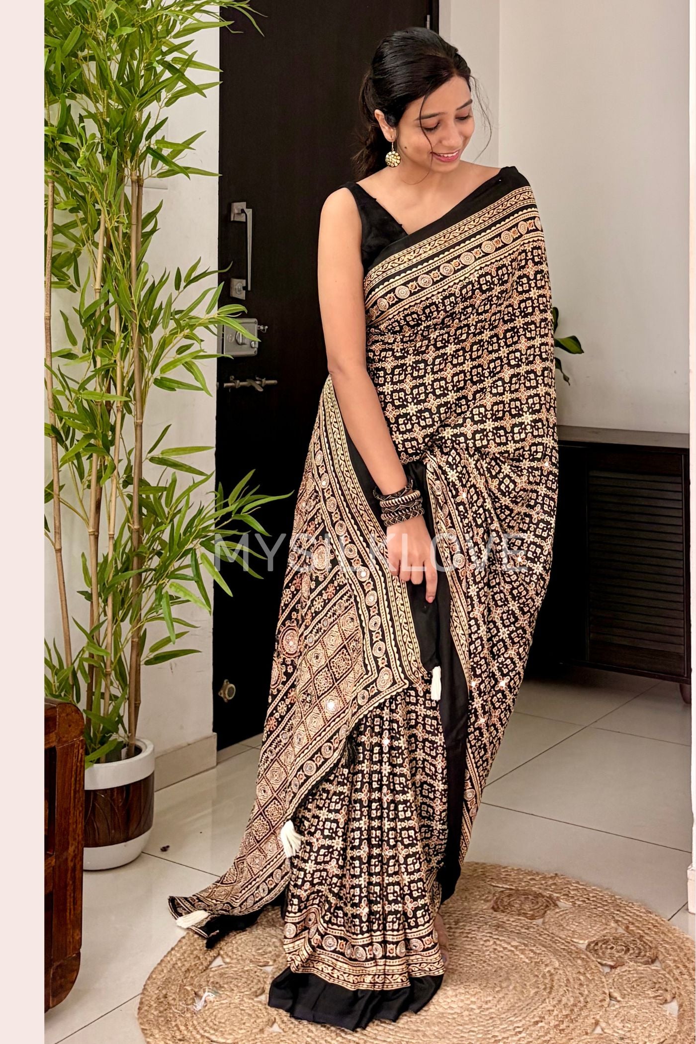 Buy MySilkLove Metal Black Modal Ajrakh Satin Printed Mirror Work Saree Online