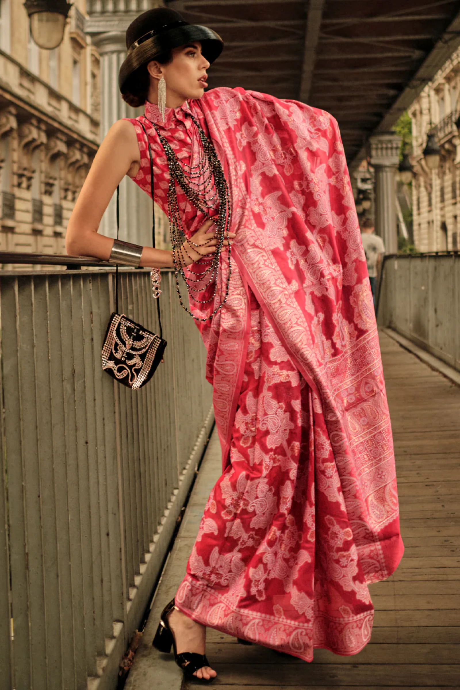 Rose Pink Lucknowi Chikankari saree draped over the shoulder, showing white shadow-work embroidery across the pallu