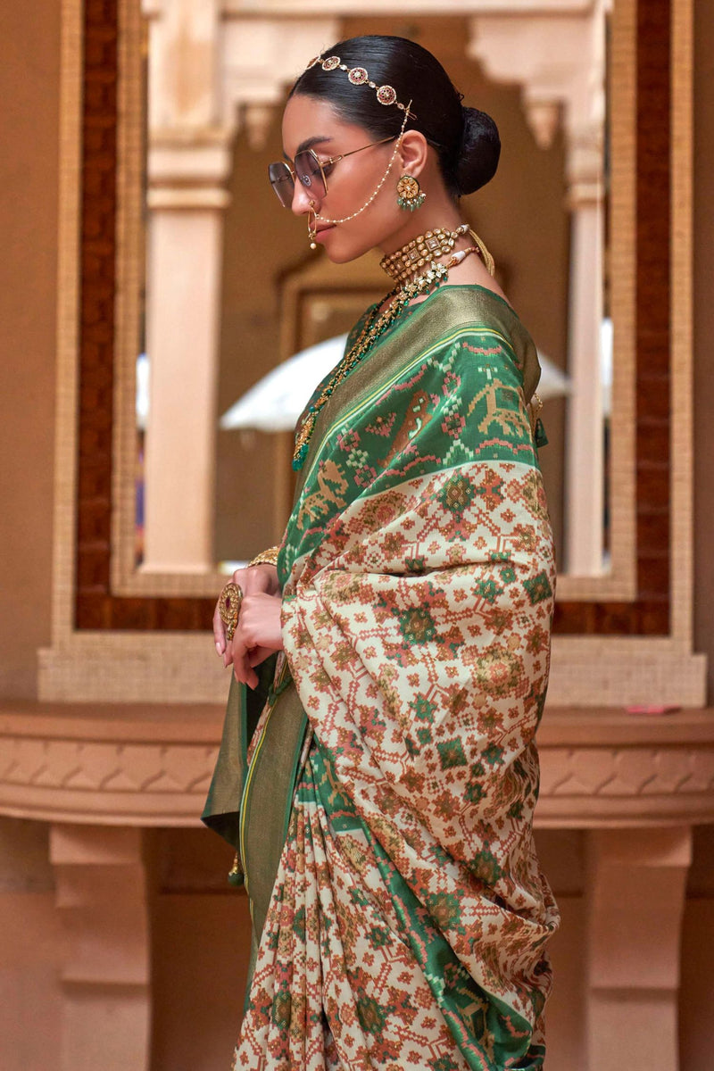 Photo of Bride in orange and green saree with layered temple jewellery