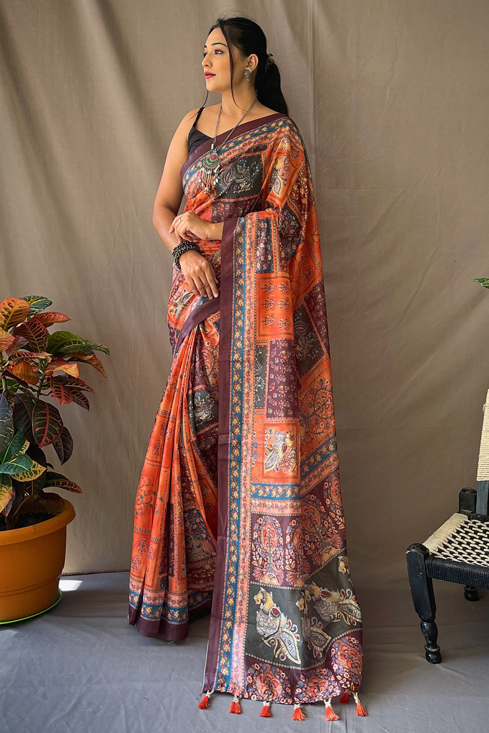 Tangerine orange Kalamkari cotton saree, a bright festive choice for Chhath Puja ghat rituals